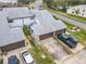 Aerial view showing townhouses, landscaping, and parking at 347 Castlewood Ln, New Smyrna Beach, FL 32168