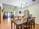 Bright dining room with hardwood floors and view of living room at 347 Castlewood Ln, New Smyrna Beach, FL 32168