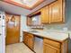 Oak cabinets, white appliances, and a double sink at 347 Castlewood Ln, New Smyrna Beach, FL 32168