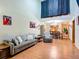 Bright living room featuring hardwood floors and ample natural light at 347 Castlewood Ln, New Smyrna Beach, FL 32168