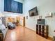 Spacious living room with high ceilings and hardwood floors at 347 Castlewood Ln, New Smyrna Beach, FL 32168