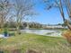 Serene pond view from backyard with fountain at 347 Castlewood Ln, New Smyrna Beach, FL 32168