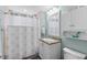 Clean bathroom with white vanity and shower/tub combo at 3737 S Atlantic Ave # 504, Daytona Beach, FL 32118