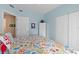 Comfortable bedroom with white trim and colorful bedding at 3737 S Atlantic Ave # 504, Daytona Beach, FL 32118