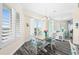 Dining room features a wood table, white chairs, and a view at 3737 S Atlantic Ave # 504, Daytona Beach, FL 32118
