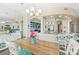 Bright dining room with hardwood floors and water views at 3737 S Atlantic Ave # 504, Daytona Beach, FL 32118