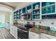 Modern kitchen featuring granite countertops and stainless steel appliances at 3737 S Atlantic Ave # 504, Daytona Beach, FL 32118