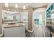 Open kitchen with island, granite countertops, and hardwood floors at 3737 S Atlantic Ave # 504, Daytona Beach, FL 32118