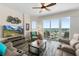 Bright living room with water views and sliding glass doors to balcony at 3737 S Atlantic Ave # 504, Daytona Beach, FL 32118