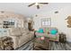 Comfortable living room with sectional sofa and hardwood floors at 3737 S Atlantic Ave # 504, Daytona Beach, FL 32118