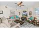 Spacious living room with a sectional sofa and large TV at 3737 S Atlantic Ave # 504, Daytona Beach, FL 32118