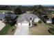 Beautiful aerial view of a well-maintained home with lush landscaping and neighborhood at 428 Hightower Dr, Debary, FL 32713