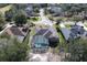 Aerial view of a screened-in pool, well-maintained roof, and lush greenery at 428 Hightower Dr, Debary, FL 32713