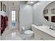 Bathroom with toilet, vanity, and exterior access at 428 Hightower Dr, Debary, FL 32713