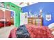 Bedroom with a double bed, green and blue walls, and built-in shelving at 428 Hightower Dr, Debary, FL 32713