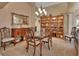 Formal dining room, featuring a glass-top table and ornate chairs at 428 Hightower Dr, Debary, FL 32713