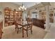 Bright dining room with a large table and built-in shelving at 428 Hightower Dr, Debary, FL 32713