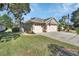 Two-car garage and nicely landscaped front yard at 428 Hightower Dr, Debary, FL 32713