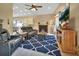 Gathering room with fireplace, comfortable seating and large TV at 428 Hightower Dr, Debary, FL 32713