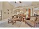 Spacious living room featuring comfortable seating and a large TV at 428 Hightower Dr, Debary, FL 32713