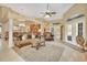 Elegant living room with high ceilings, hardwood floors, and comfortable seating at 428 Hightower Dr, Debary, FL 32713