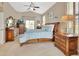 Comfortable main bedroom with wood furnishings and en-suite bathroom at 428 Hightower Dr, Debary, FL 32713