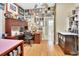 Home office with L-shaped desk, wood flooring, and award wall at 428 Hightower Dr, Debary, FL 32713