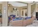 Spacious covered patio with stylish furniture and ceiling fan, great for entertaining at 428 Hightower Dr, Debary, FL 32713