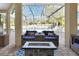 Covered outdoor patio with comfortable seating area and fire pit, ideal for relaxing at 428 Hightower Dr, Debary, FL 32713