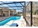 Refreshing screened-in pool area with a covered patio, ideal for year-round enjoyment at 428 Hightower Dr, Debary, FL 32713