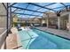 Inviting screened pool area with ample seating and outdoor grill, perfect for entertainment at 428 Hightower Dr, Debary, FL 32713