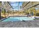 Screened pool area with lounge chairs and brick pavers at 428 Hightower Dr, Debary, FL 32713