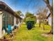 Backyard patio with seating and grill, lush landscaping at 430 Terrace Hill Blvd # 6A, Debary, FL 32713