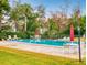 Community pool with lounge chairs and umbrellas at 430 Terrace Hill Blvd # 6A, Debary, FL 32713