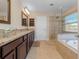 Elegant bathroom with double vanity, soaking tub, and shower at 442 Anessa Rose Loop, Ocoee, FL 34761