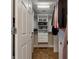 Large walk-in closet with custom built-ins and shelving at 442 Anessa Rose Loop, Ocoee, FL 34761