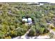Bird's eye view of property showing home, detached garage and surrounding landscape at 4525 Owls Nest Ct, De Leon Springs, FL 32130