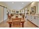 Dining area flows into the living space and features built-in cabinets for ample storage at 4525 Owls Nest Ct, De Leon Springs, FL 32130