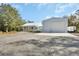 Charming property with a large metal building and a cozy home, set on a spacious lot with ample parking space at 4525 Owls Nest Ct, De Leon Springs, FL 32130