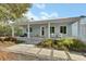 Charming single-story home with a welcoming front porch and meticulously landscaped front yard at 4525 Owls Nest Ct, De Leon Springs, FL 32130
