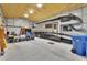 Spacious garage with high ceilings, housing an RV and ample storage space at 4525 Owls Nest Ct, De Leon Springs, FL 32130