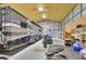 Spacious garage interior with a large RV, fitness equipment, and ample storage, offering versatility and functionality at 4525 Owls Nest Ct, De Leon Springs, FL 32130