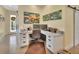 Home office includes a built-in desk, storage, and plenty of natural light at 4525 Owls Nest Ct, De Leon Springs, FL 32130