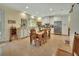 Spacious kitchen with stainless steel appliances, white cabinetry, and an adjacent dining area at 4525 Owls Nest Ct, De Leon Springs, FL 32130