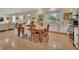 Bright, open-concept kitchen and dining area with modern appliances and a large window at 4525 Owls Nest Ct, De Leon Springs, FL 32130