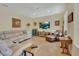 Spacious living room with neutral tones, a large window, recessed lighting, and comfortable furnishings at 4525 Owls Nest Ct, De Leon Springs, FL 32130