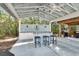 Stylish outdoor bar area with seating, ideal for entertaining guests at 4525 Owls Nest Ct, De Leon Springs, FL 32130