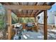 Covered outdoor grilling area with wood accents, perfect for barbecues at 4525 Owls Nest Ct, De Leon Springs, FL 32130