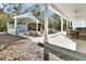 Extensive outdoor living space with a bar, spa, grill, and dining area perfect for entertaining at 4525 Owls Nest Ct, De Leon Springs, FL 32130