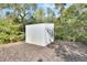 View of the metal storage shed in the yard at 4525 Owls Nest Ct, De Leon Springs, FL 32130